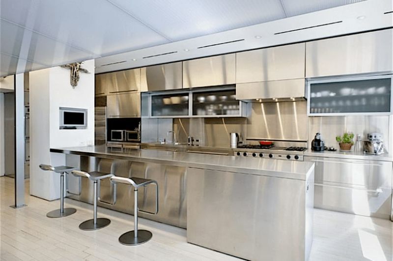 A home with a spotless—and space-enhancing—stainless steel kitchen.